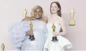  ?? -AP PHOTO ?? Da'Vine Joy Randolph, Best Supporting Actress for 'The Holdovers,' and Emma Stone, Best Actress for 'Poor Things,' celebrate their wins.