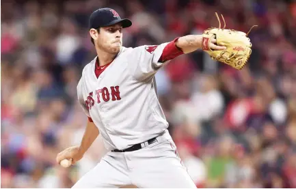  ??  ?? Boston Red Sox starting pitcher Doug Fister throws a pitch during the first inning against the Cleveland Indians at Progressiv­e Field on Tuesday. (USA TODAY Sports)