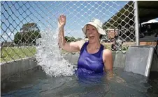  ?? Photo: Bev Lacey ?? STAYING COOL: Centenary Heights State High School teacher Jodie Coprum stayed cool as she got dunked at a school event yesterday.