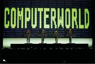  ?? JANE TYSKA — BAY AREA NEWS GROUP ?? Kraftwerk members Ralf Hutter, Henning Schmitz, Fritz Hilpert and Falk Grieffenha­gen, from left, perform at the Bill Graham Civic Auditorium in San Francisco on Wednesday.