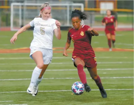  ?? Ned Gerard/Hearst Connecticu­t Media ?? Area religious schools, such as St. Joseph High School in Trumbull, offer comprehens­ive sports programs. Here, Trumbull’s Lauren Mecca, left, and St. Joseph’s Laci Lewis in high school soccer action at St. Joseph High School, in Trumbull, Conn. Oct. 1, 2020.