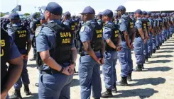  ?? HENK KRUGER African News Agency (ANA) ?? MEMBERS of the new SAPS Anti Gang Unit walk the streets of Hanover Park before its official launch. |