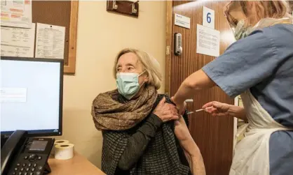  ?? Photograph: Gary Calton/The Observer ?? 82-year-old Beryl Seal is given her second dose of the Pfizer vaccine.