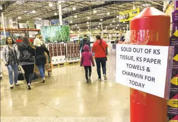  ?? Gillian Flaccus Associated Press ?? A COSTCO STORE in Tigard, Ore., where some items were out of stock. The CDC director told Congress that healthy Americans need not stock up on supplies. Still, many stores are reporting above-average crowds.