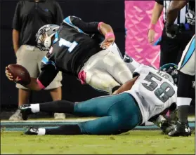  ?? AP PHOTO ?? Carolina Panthers’ Cam Newton leans over the goal line for a touchdown as Philadelph­ia Eagles’ Jordan Hicks defends.