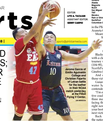  ?? JUN MENDOZA ?? Jerome Garcia of Emilio Aguinaldo College and Christian Fajarito of Letran battle for the leather in their NCAA match yesterday at the Filloil Flying V Center.