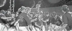  ?? SUN DEVIL ATHLETICS ?? ASU freshman Ethan Long (35) celebrates with his teammates after hitting a walk-off homer against Oregon State.