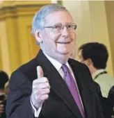  ?? BRENDAN SMIALOWSKI/ AFP/ GETTY IMAGES ?? Sen. Mitch McConnell, R- Ky., signals success after Monday’s vote.