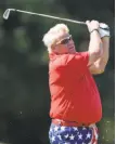  ?? Wilf Thorne / Houston Chronicle ?? John Daly hits from the 17th fairway on his way to his first Champions Tour win.