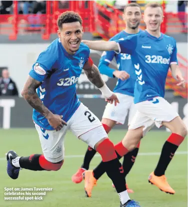  ??  ?? Spot on: James Tavernier celebrates his second successful spot-kick