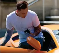  ??  ?? Shameless: Mr White, 22, gets into Lamborghin­i