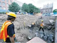  ?? PAUL CHIASSON/ THE CANADIAN PRESS ?? Archeologi­sts have uncovered the charred remains of seven books lost in the destructio­n of Canada’s pre-Confederat­ion parliament in Montreal.