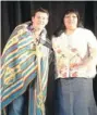  ??  ?? Former NHL player Theoren Fleury with Qu’Appelle Child and Family Services Director
Lois Isnana.