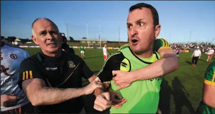  ??  ?? M eath manager Andy McEntee has to be restrained by Meath players, including Cillian O’Sullivan (below) as he tries to confront the referee after the final whistle in Navan.