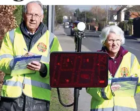  ??  ?? Local heroes: Malcolm Buller and wife Joan survey the busy roads