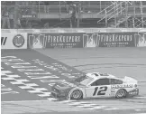  ?? CARLOS OSORIO/AP ?? Ryan Blaney won Sunday’s NASCAR race at Michigan Internatio­nal Speedway by 0.077 seconds over William Byron. It was Blaney’s second win of 2021.