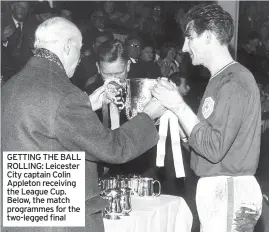  ??  ?? GETTING THE BALL ROLLING: Leicester City captain Colin Appleton receiving the League Cup. Below, the match programmes for the two-legged final