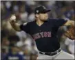  ?? JAE C. HONG — THE ASSOCIATED PRESS, FILE ?? Red Sox pitcher Nathan Eovaldi throws against the Dodgers during Game 3 of the World Series in Los Angeles.