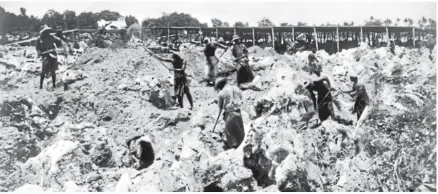  ?? ALEXANDER TURNBULL LIBRARY REF: PACOLL-6044-01 ?? Workers dig for phosphate on Banaba, the Kiribati island formerly known as Ocean Island.