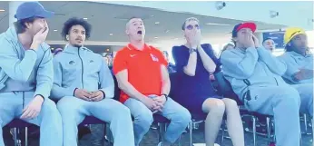  ?? PHOTO BY JADYN FINCH/BRONCO NATION NEWS ?? Boise State players, coach Leon Rice (center) and university president Dr. Marlene Tromp react Sunday after learning the Broncos were headed to the First Four in Dayton to play Colorado.