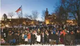  ?? STACEY WESCOTT/CHICAGO TRIBUNE ?? Crowds gather before sunrise Thursday in Woodstock Square as they await Woodstock Willie during the 30th annual Groundhog Day celebratio­n in Woodstock.