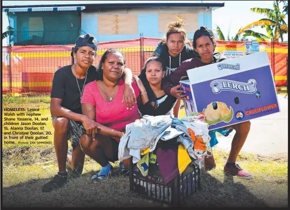  ?? Picture: ZAK SIMMONDS ?? HOMELESS: Lenice Walsh with nephew Shane Yasserie, 14, and children Jason Doolan, 15, Alanna Doolan, 17, and Christine Doolan, 20, in front of their gutted home.