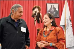  ?? ?? Russell Eagle Bear, with the Rosebud Sioux Reservatio­n Tribal Council, talks to Haaland during the meeting about Native American boarding schools at Sinte Gleska University.