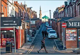  ?? ?? VACCINE WARY: A side street in the deprived Leeds district of Harehills South