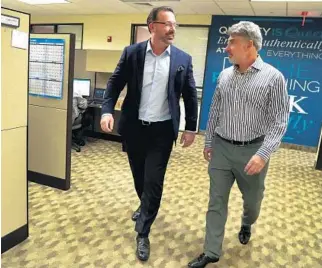  ?? CARLINE JEAN/STAFF PHOTOGRAPH­ER ?? CEO Robert Finizio, left, and chief clinical officer Dr. Brian Bernick in the Boca Raton headquarte­rs of Therapeuti­csMD.