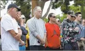  ?? Nelvin C. Cepeda San Diego Union-Tribune ?? THE MOOD was solemn as the names of the crash victims were read on the 40th anniversar­y Tuesday.