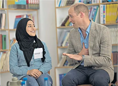  ??  ?? The Duke met with Palestinia­n students at a United Nations-run school at Jalazone refugee camp; with Mahmoud Abbas, the Palestinia­n president, left