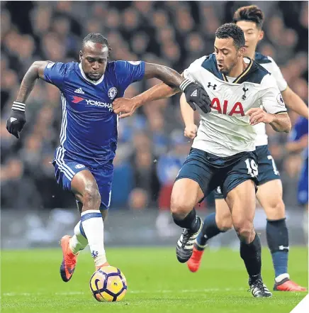  ??  ?? ■ Chelsea’s Victor Moses (left) and Tottenham Hotspur’s Mousa Dembele fight for the ball.