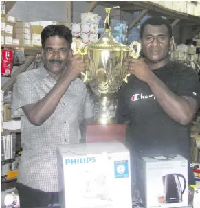  ?? Charles Chambers ?? Lautoka Golf Club officials Gaffar Ahmad(left) and Tomasi Nanuqa with Geotech Drilling sponsored trophy in Lautoka on November 8, 2017.Photo: