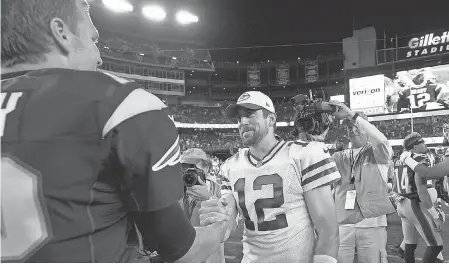  ?? DAVID BUTLER II/USA TODAY SPORTS ?? The Patriots’ Tom Brady and the Packers’ Aaron Rodgers, right, will meet in a heavyweigh­t showdown Sunday.