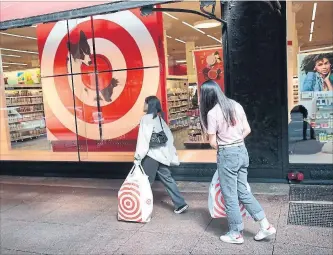  ?? SCOTT OLSON GETTY IMAGES ?? Target has been spending heavily to remodel stores and lower prices to compete for customers.