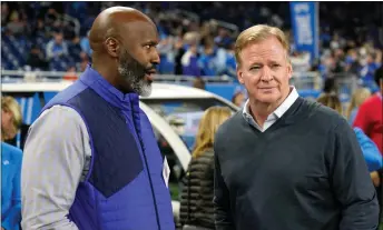  ?? PAUL SANCYA — AP PHOTO, FILE ?? Detroit Lions general manager Brad Holmes, left, talks with NFL Commission­er Roger Goodell before the first half of a game last year in Detroit.