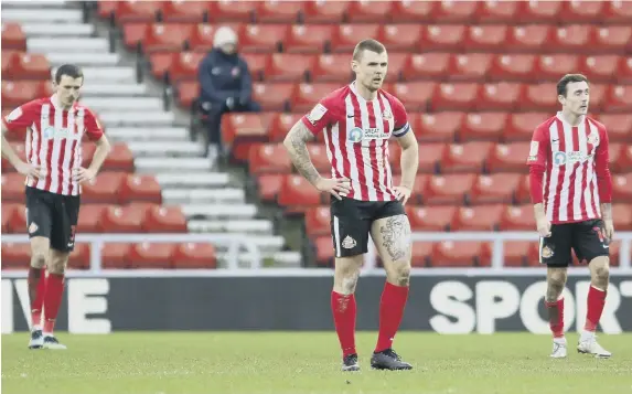  ?? ?? Dejected Sunderland players at the full-time whistle.