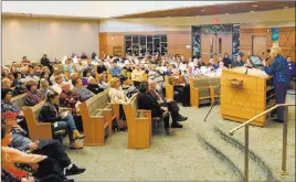  ??  ?? The audience at Temple Sinai listens to Celina Karp Biniaz as she shares her story.