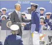  ??  ?? Phillip Mays Jr. shook President Barack Obama’s hand at his commenceme­nt ceremony from the U.S. Air Force Academy.