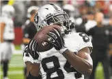  ?? Norm Hall / Getty Images ?? Raiders wide receiver Antonio Brown, on the mend from frostbite, warms up before his team defeated the Cardinals on Thursday.