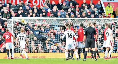  ?? — AFP photo ?? Burnley’s Belgian midfielder Steven Defour (C) watches as his shot go in to score their second goal during the English Premier League football match between Manchester United and Burnley at Old Trafford in Manchester, north west England, on December...