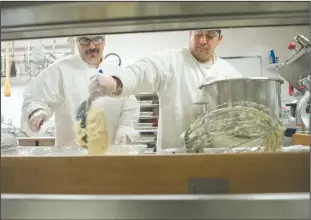  ?? NEWS-SENTINEL PHOTOGRAPH­S BY BEA AHBECK ?? Edward Ochoa and Daniel Reveles, students in Salvation Army’s Culinary Arts program at Hope Harbor, prepare mashed potatoes ahead of Thanksgivi­ng dinner on Wednesday morning at the Salvation Army in Lodi.