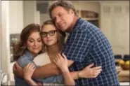  ?? GLEN WILSON/WARNER BROS. ENTERTAINM­ENT VIA AP ?? This image released by Warner Bros. Pictures shows Amy Poehler, from left, Ryan Simpkins and Will Ferrell in a scene from “The House.”