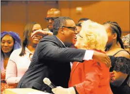  ?? K.M. Cannon ?? Las Vegas Review-journal @Kmcannonph­oto Las Vegas City Councilman Cedric Crear hugs Mayor Carolyn Goodman after he was sworn in as Ward 5 councilman during a council meeting Wednesday.