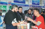  ??  ?? Foreign buyers show great interest in local products at last year’s expo.