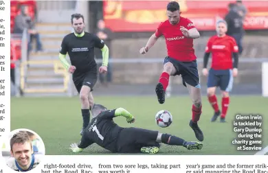  ??  ?? Glenn Irwin is tackled by Gary Dunlopduri­ng the charity gameat Seaview