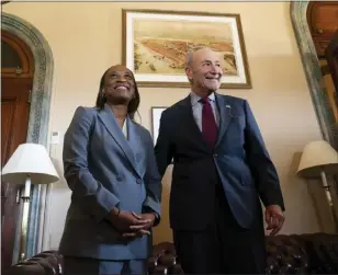  ?? STEPHANIE SCARBROUGH — THE ASSOCIATED PRESS ?? Senate Majority Leader Chuck Schumer, D-N.Y., meets with Laphonza Butler before she is sworn in to succeed the late Sen. Dianne Feinstein, D-Calif., on Tuesday on Capitol Hill in Washington.
