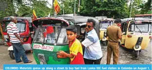  ?? ?? COLOMBO: Motorists queue up along a street to buy fuel from Lanka IOC fuel station in Colombo on August 1, 2022. — AFP