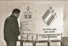  ?? AFP ?? A man prepares to cast his vote in Meghalaya. The first four general elections in the country were held simultaneo­usly with assemblies. This pattern was disturbed in 196869