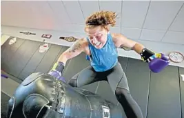  ??  ?? Amateur MMA fighter Miranda Barber practices her ground and pound technique during a training session at Moncaio Brothers gym in Fort Lauderdale. Barber says she spends most of her free time training to become a profession­al fighter while also working two jobs.